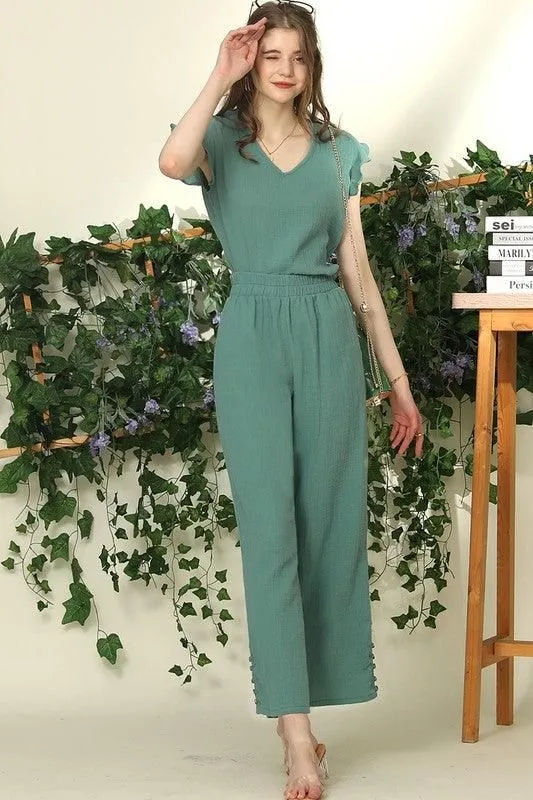 BANDED SMOCKING LONG PANTS WITH BUTTON DETAILED