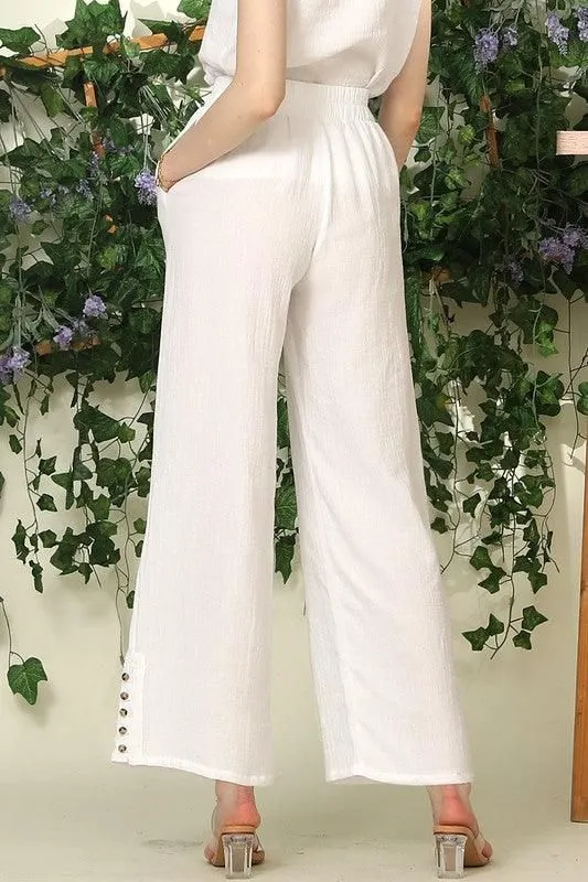 BANDED SMOCKING LONG PANTS WITH BUTTON DETAILED